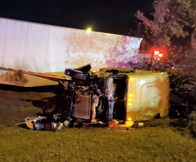 Semi-truck flips over after crashing through guardrail on I-75 in Ocala