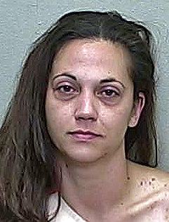 Kicking Ocala woman screams about men in green while being arrested for DUI