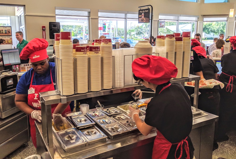 Staff prepare food for preview event at Wawa on E. Silver Springs Blvd in Ocala