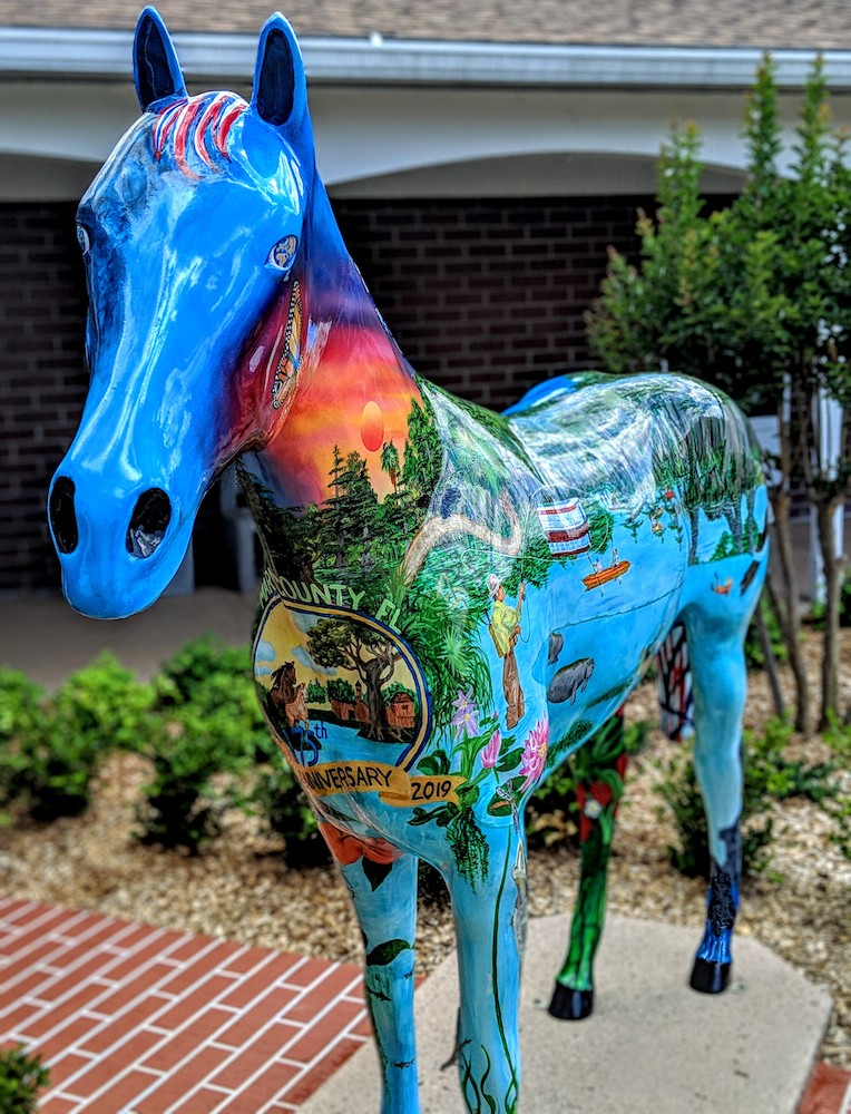 Painted horse celebrates Marion County's 175th Anniversary with intricately painted scenes.