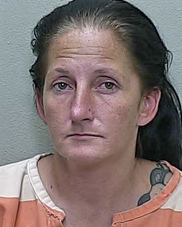Soda-throwing Citra woman accused of yanking lanyard off man’s neck during spat over vehicle