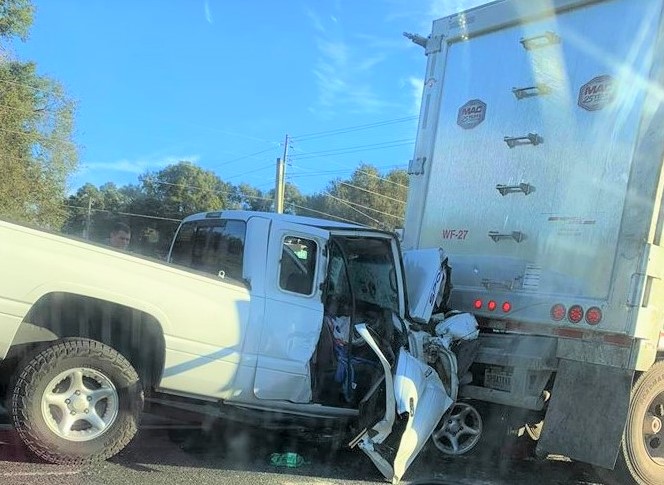 Two teens seriously injured when pickup slams into semi at stoplight