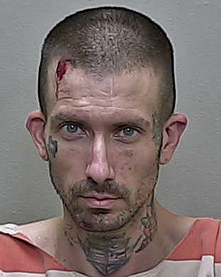 Drug suspect who gave false name identified by face and neck tattoos
