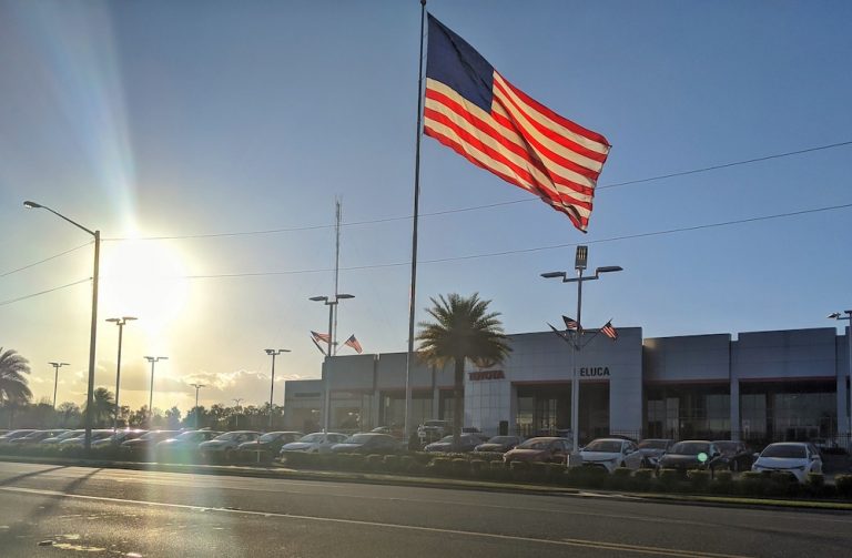 American Flag Flying Over Deluca Toyota On SR 200