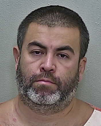 Fast-driving Ocala man accused of punching woman and jumping out of car