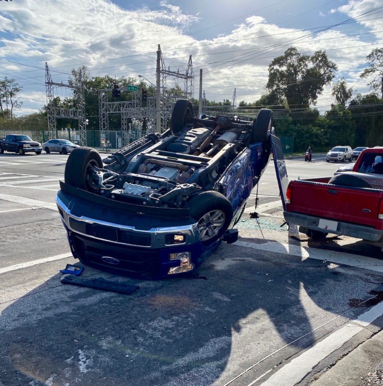 Driver kicks out window to free himself after pickup overturns in Ocala