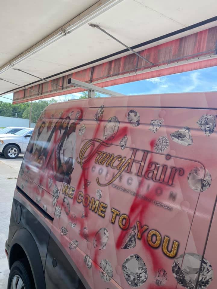 KKK spray painted on vehicle in Ocala