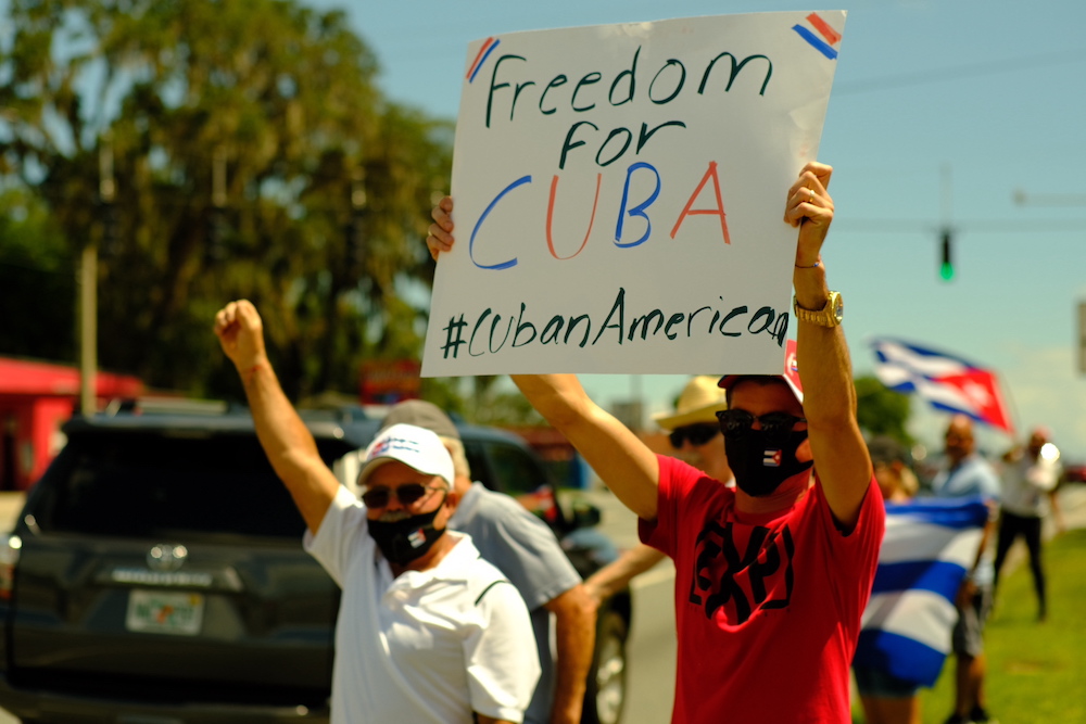 Cuban protesters hold 22Freedom For Cuba22 sign in Ocala Florida on July 17 Photo courtesy of Tommy Cuevas