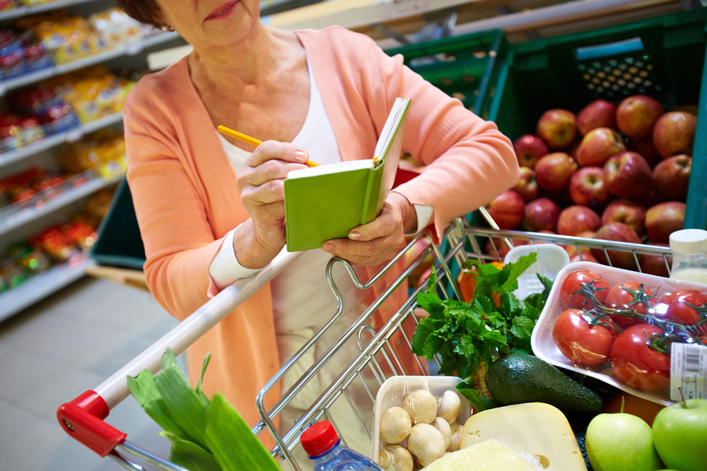 Elderly woman grocery shopping