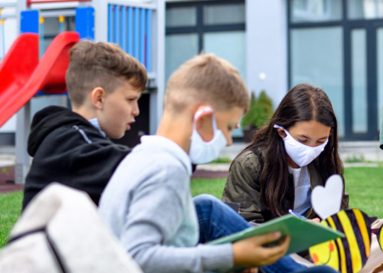 Students wearing masks and not wearing mask at school
