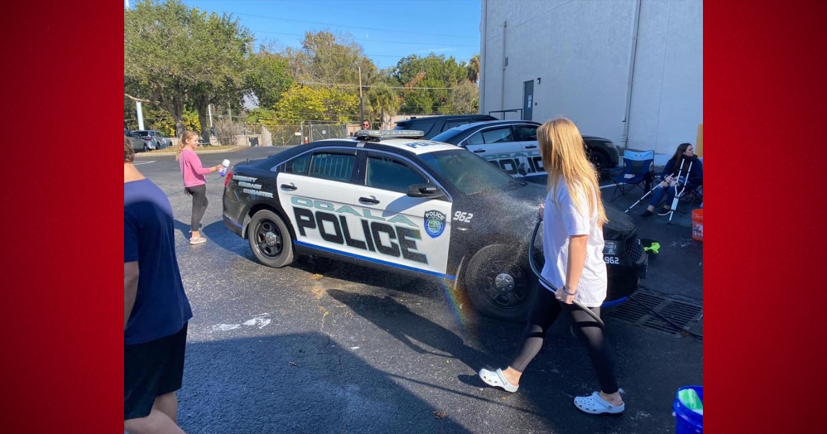 Local middle school students surprise Ocala Police Department with car wash 2