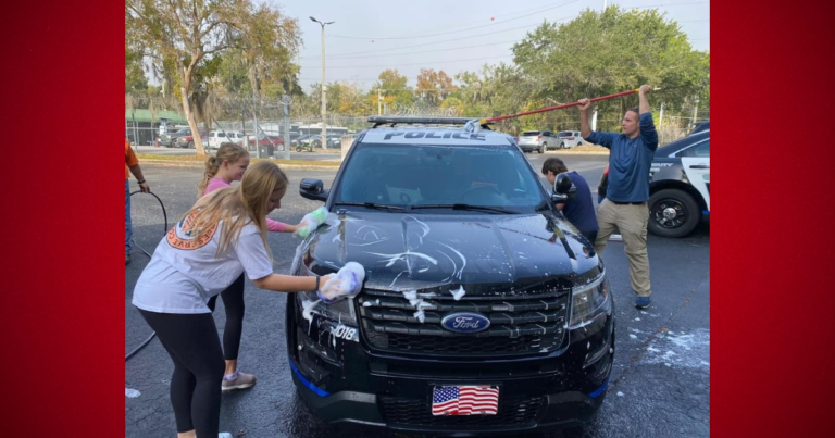 Local middle school students surprise Ocala Police Department with car wash