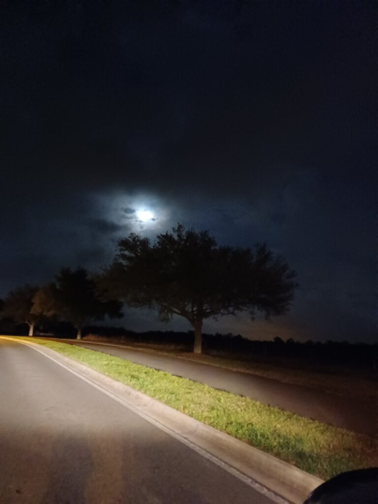 Full Moon Blanketed by Storm Clouds Over Stone Creek In Ocala