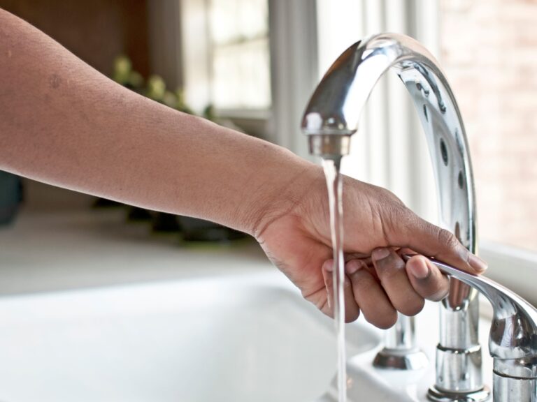 water faucet with hand featured image