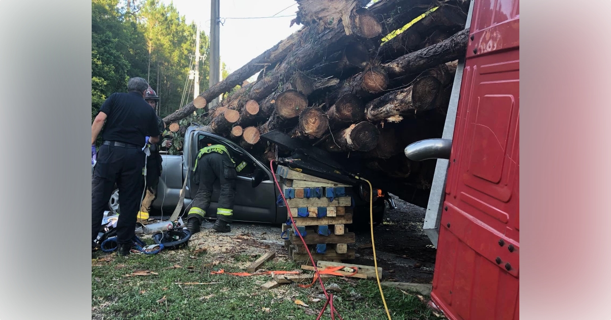Driver extricated after falling logs crush pickup truck in NW Ocala