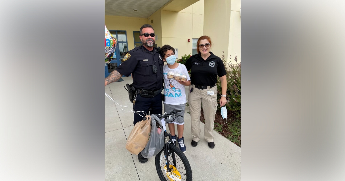 OPD officer receives award after surprising local child with bicycle 1