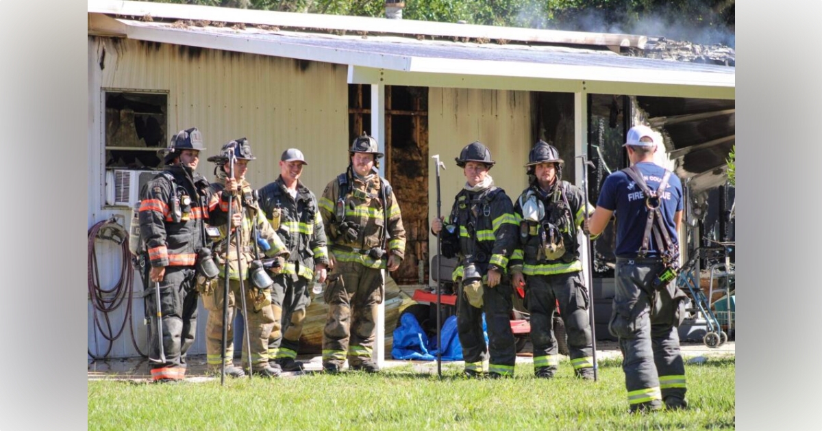 Marion County firefighters rescue woman dog from burning home 2