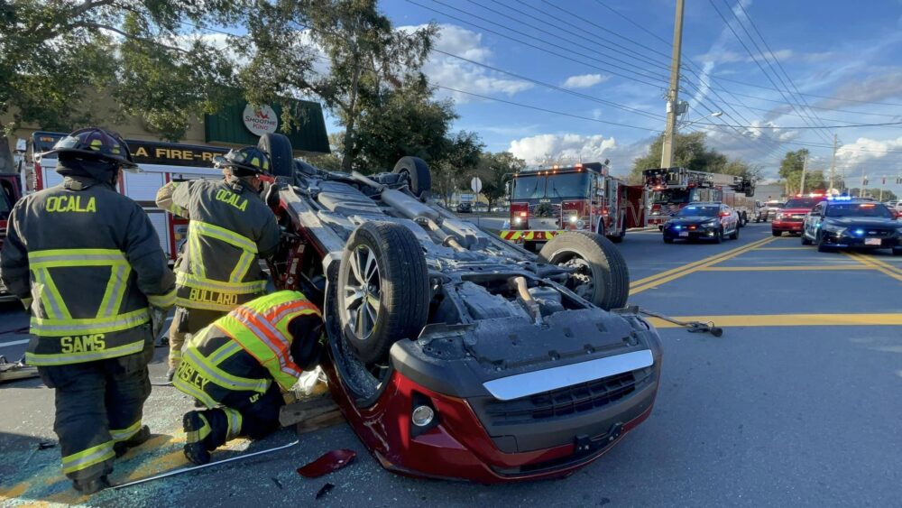 Crash with rollover (December 5, 2022) - Ocala Fire Rescue firefighters extricating the SUV's driver