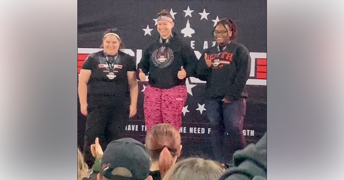 Belleview Police Department Officer Jessica Galler at the podium after winning 1st place in her division at the 2023 Battle Axe Barbell Showdown in Texas 