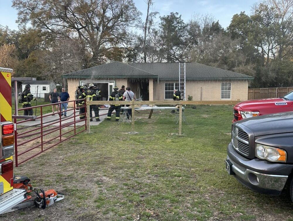 Marion County Fire Rescue NE Ocala home fire on February 20 2023 - exterior shot of firefighters and home