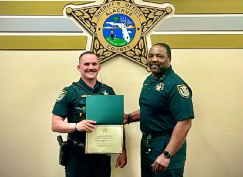 Alachua County Sheriffs Office deputy receives life saving award for saving man who threatened to jump off I 75 overpass in Gainesville