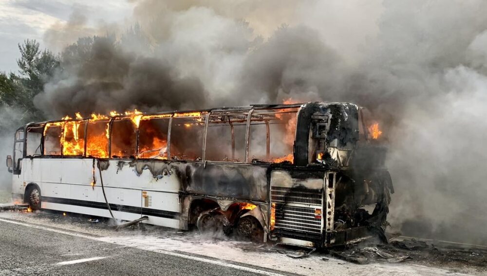 MCFR tour bus fire on Interstate 75 on March 29, 2023 - tour bus with rising flames and smoke