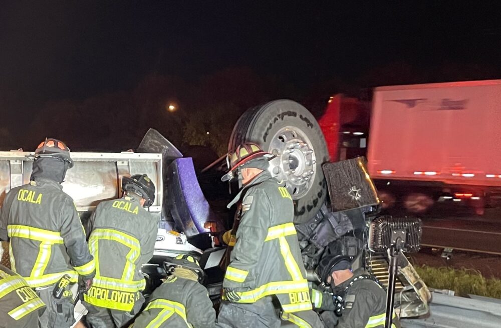 Overturned semi on I-75 northbound near exit 352 on March 13, 2023 (Ocala Fire Rescue) - crews extricating passenger