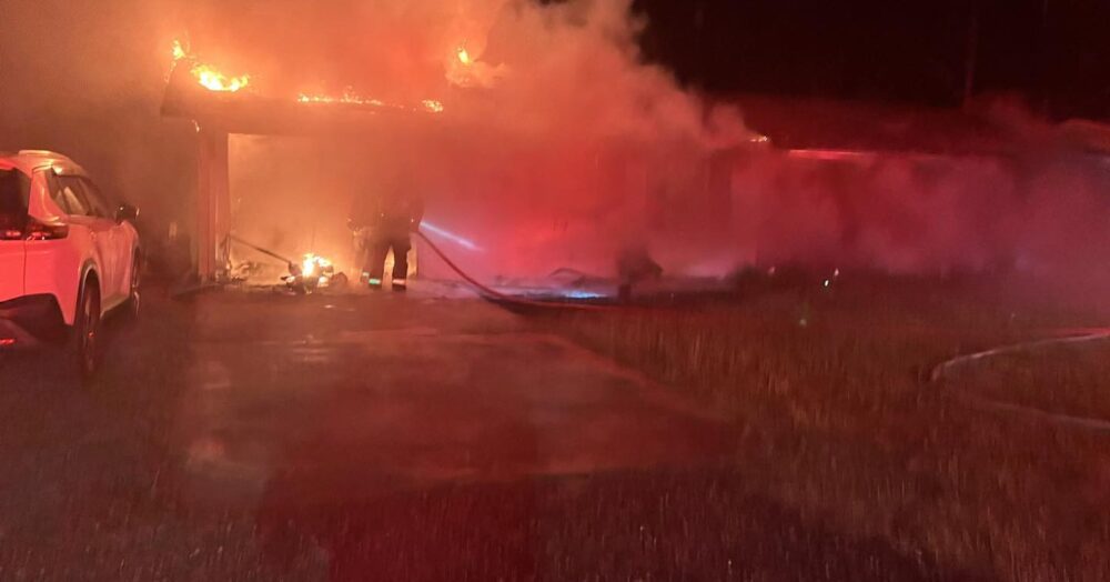 MCFR and OFR respond to Ocala house fire on June 29, 2023 photo of firefighters attacking flames in garage (MCFR Battalion Chief 3)