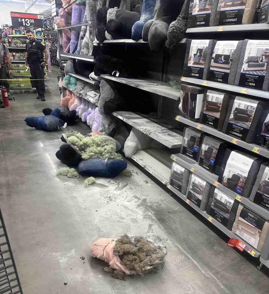 Ocala Police Department Officer surveils burnt pillows in aisle