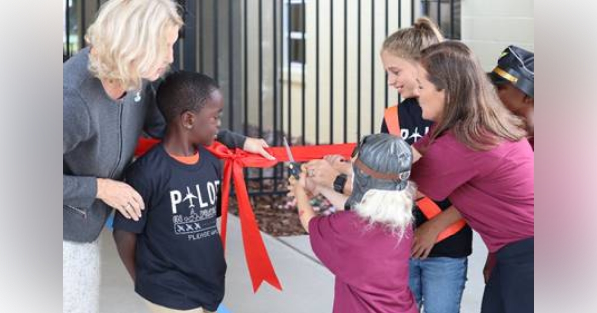 Sparr Elementary School students help cut the ribbon this morning to their new Future Aviators Academy, the newest program in Marion County Public Schools.