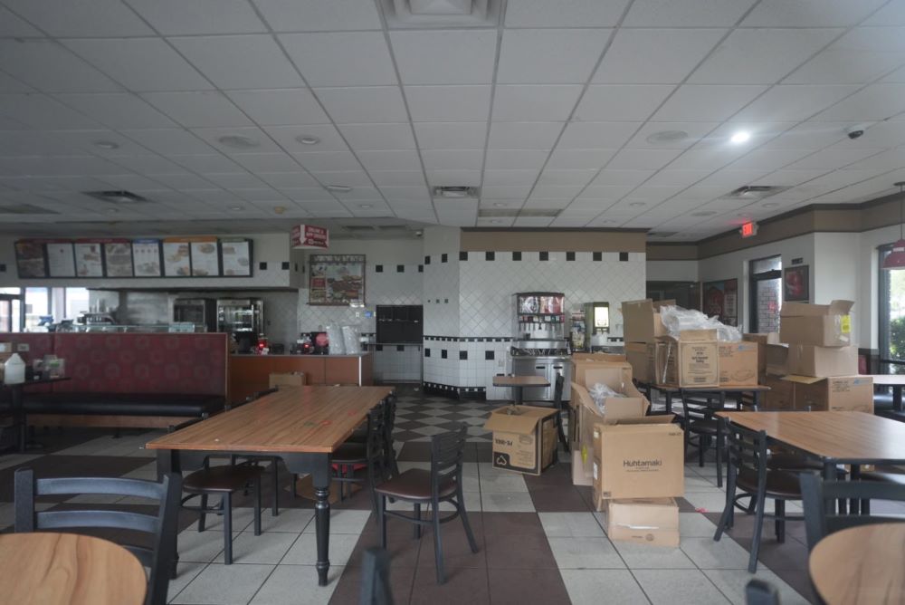 Tables, chairs and boxes at shuttered Boston Market in Ocala (September 8, 2023)