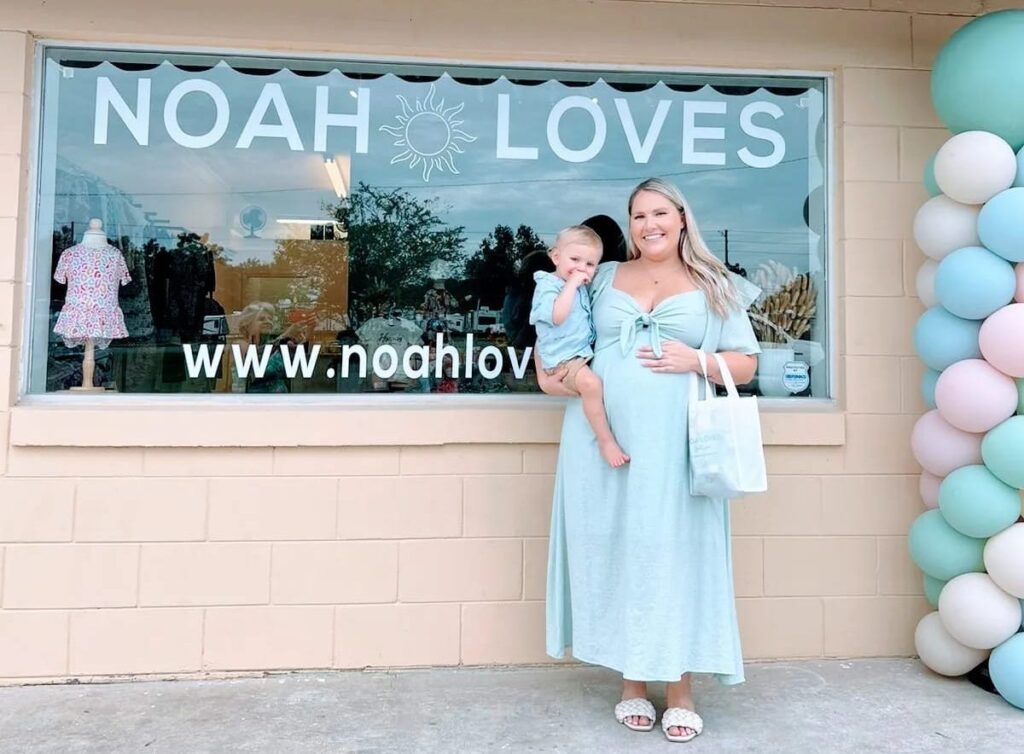 Marissa Burns and her son, Noah, in front of her new business, Noah Loves Baby Boutique