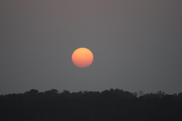Orange haze sunset over the Ocklawaha Prairie Restoration Area