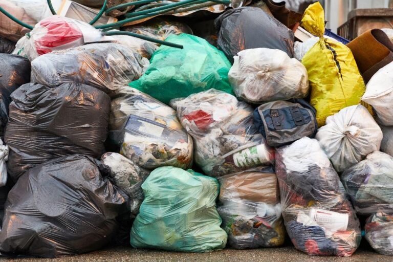 bags of trash in pile (stock image)