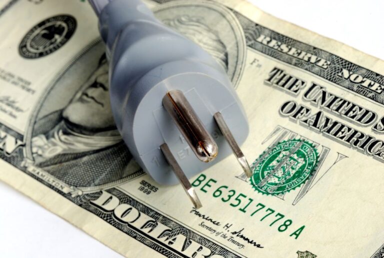 outlet on top of dollar bill (stock image)