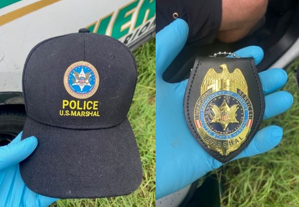 Derry Wayne Lambert photo showing hat and badge (impersonating U.S. Marshal)