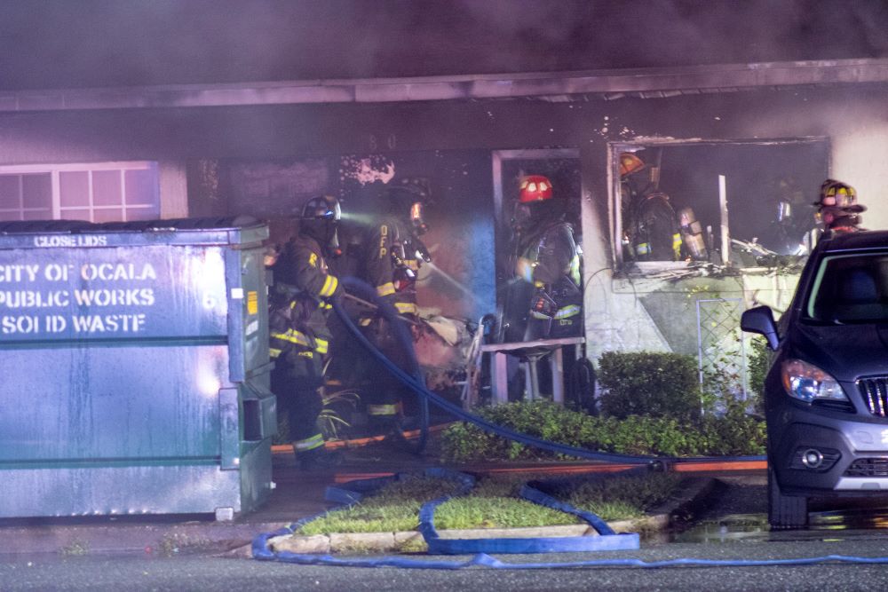 Fire at Deer Run Apartments in Ocala on November 15, 2023 firefighters outside unit after flames were extinguished (Photo by Code3Florida)