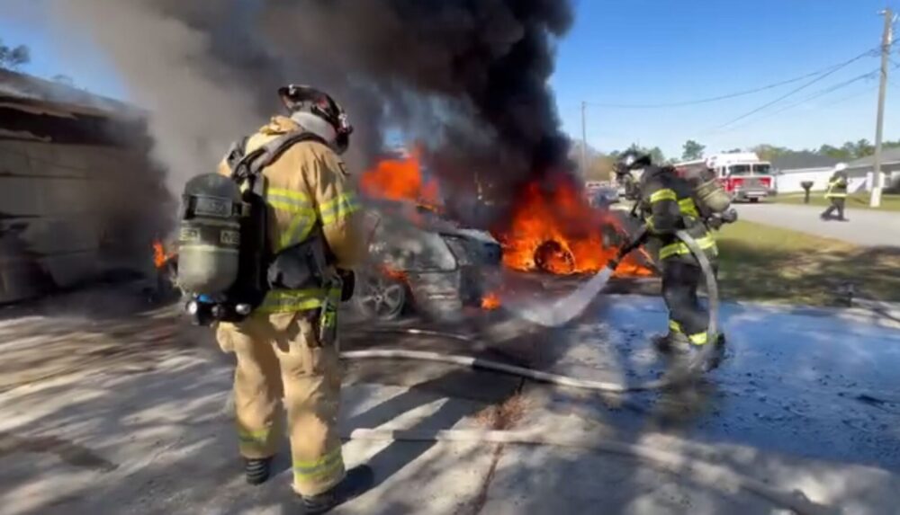 MCFR pickup truck fire spreads to other vehicles and home in SE Ocala on November 29, 2023 firefighters exintinguishing vehicle fire (2)