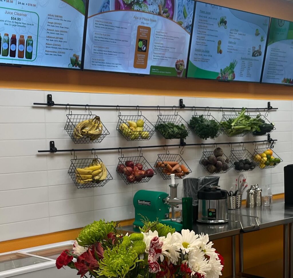 Housemade juices at Kwench Juice Cafe in Ocala Front counter at Kwench in Ocala