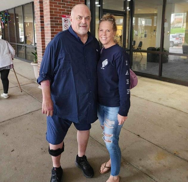 Injured MCFR Captain Chris Trubelhorn and his wife standing outside hospital on Dec 26, 2023 (Photo by Professional Firefighters of Marion County)