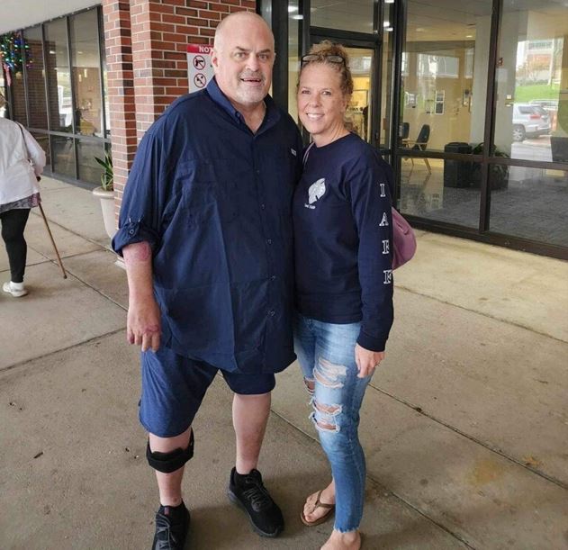 Injured MCFR Captain Chris Trubelhorn and his wife standing outside hospital on Dec 26, 2023 (Photo by Professional Firefighters of Marion County) Injured MCFR Captain Chris Trubelhorn and his wife standing outside hospital on Dec 26, 2023 (Photo by Professional Firefighters of Marion County)