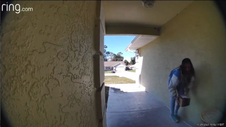 MCSO porch pirate steals package from NE Ocala home on Nov 29, 2023 suspect holding package