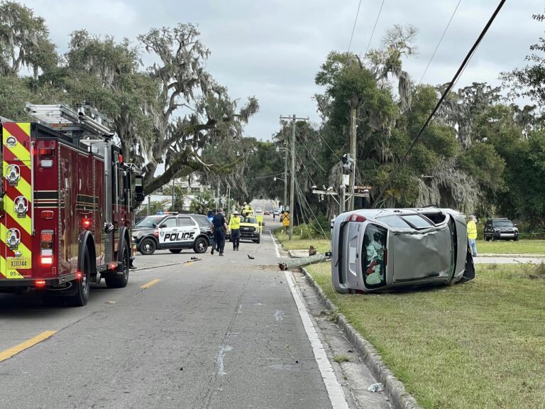 OFR driver ejected after crashing into power pole in Ocala (Dec 13, 2023) fire truck and car on side with OPD in background