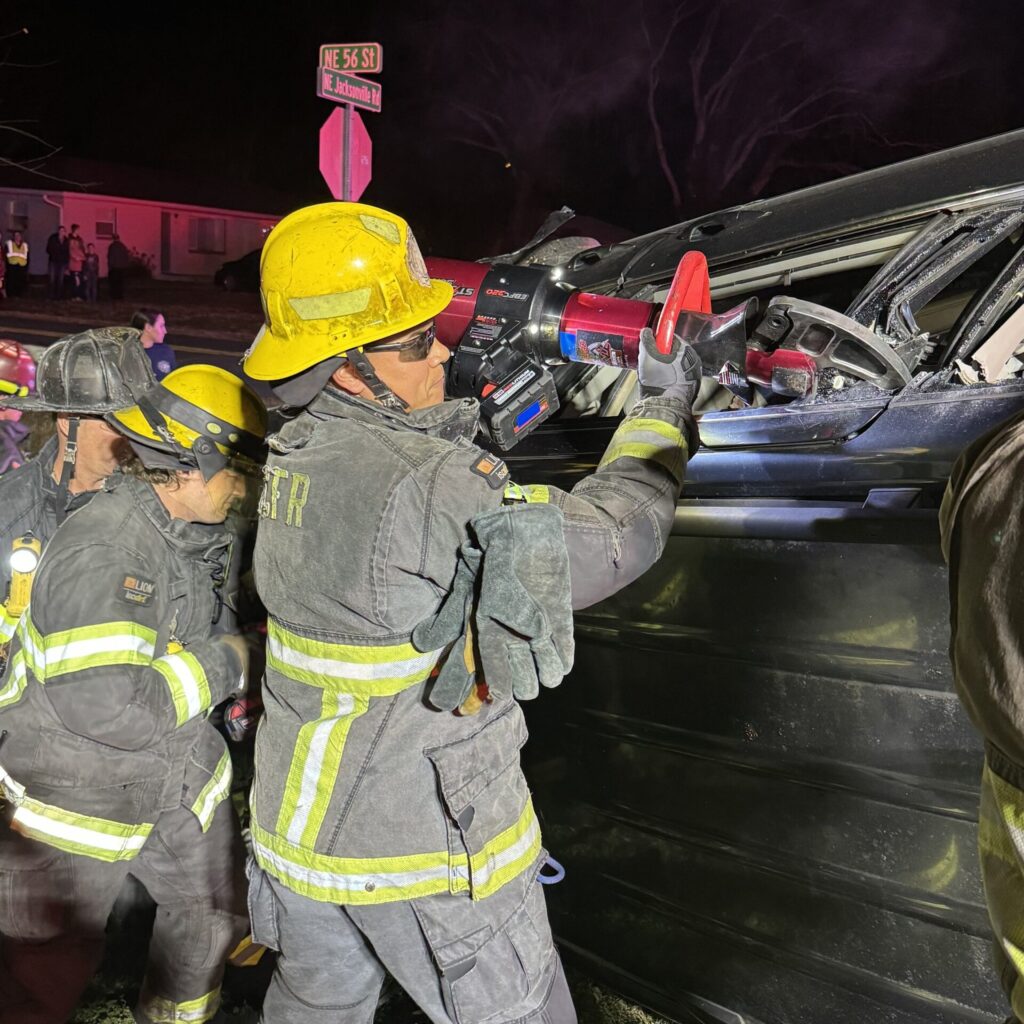 Two vehicle crash sends two to hospital on January 2, 2024 (photo MCFR) firefighters extricating driver from vehicle