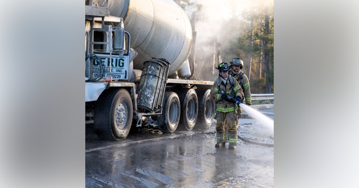 Concrete truck fire in Silver Springs on Feb 22, 2024 2 (firefighters using hose to combat fire) (photo by MCFR)