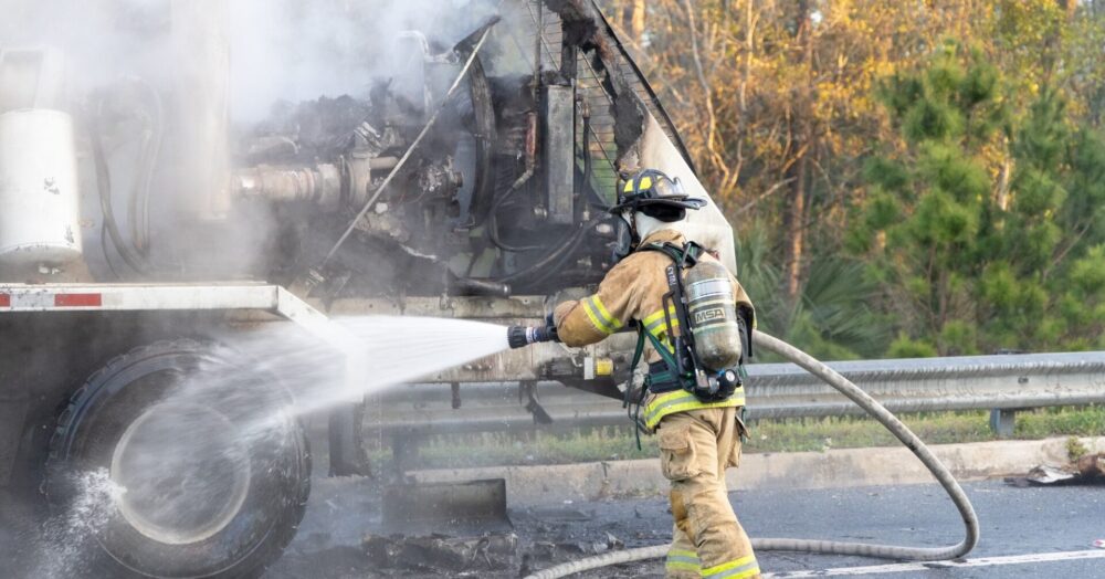 Concrete truck fire in Silver Springs on Feb 22, 2024 3 (firefighters using hose to combat fire) (photo by MCFR)