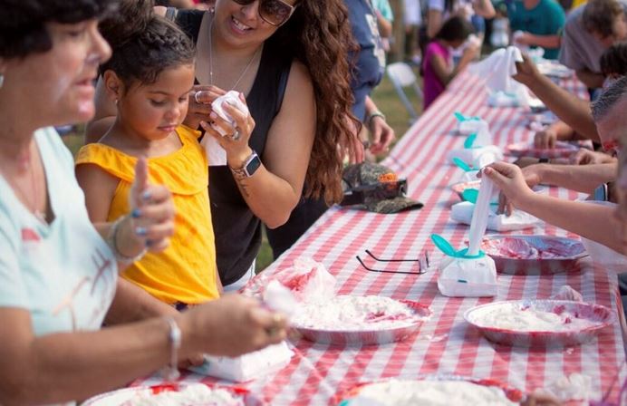 One of the festival's featured attractions is a strawberry pie eating contest. (Photo: Habitat Ocala Strawberry Festival)