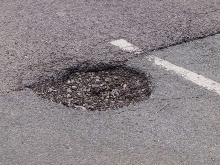 large pothole in road (stock image)