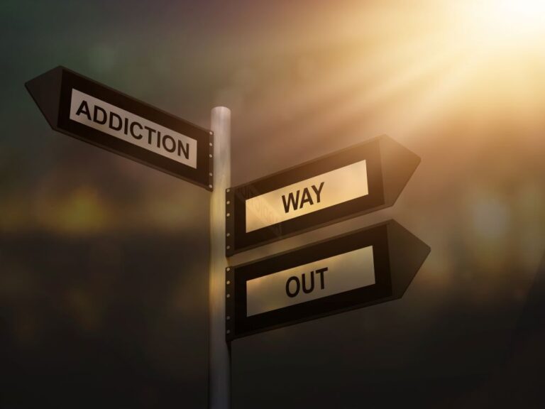 sign stating 'addiction' and 'way out' (stock image)