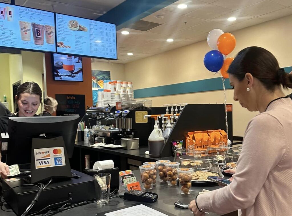 A customer completes her purchase at the new Biggby Coffee in Ocala (Photo Biggby Coffee)